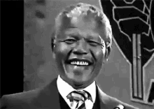 Nelson Mandela smiling during a public appearance